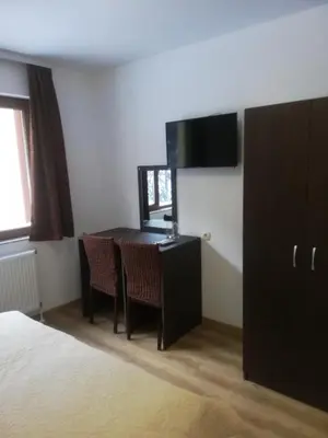 a room with a desk and a table with chairs at Вила ОБЗОР in Progled
