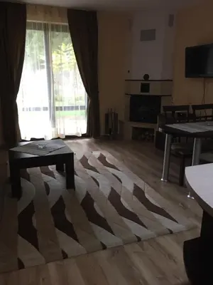 a living room with a zebra rug on the floor at Балкан вили in Ribarica
