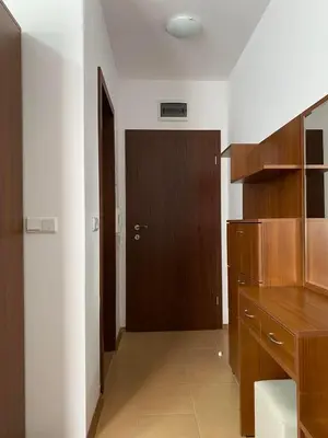a kitchen with a wooden cabinet and a door at Kalina Apartment's in Bansko in Bansko