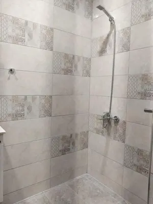 a bathroom with a shower with a glass door at Apartment Anelia 1 in Plovdiv