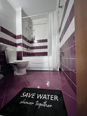 a bathroom with a toilet and a sign that says save water ranger together at Апартамент Amare, Гранд Манастира in Pamporovo