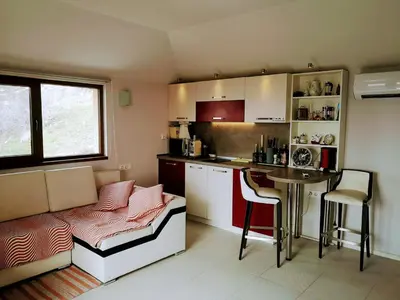 a small kitchen with a table and a counter at VillaPo in Ilindentsi