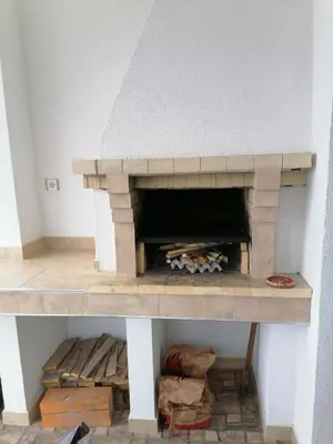 a model of a brick fireplace in a room at Къща за гости Радост Guest House Radost in Razlog