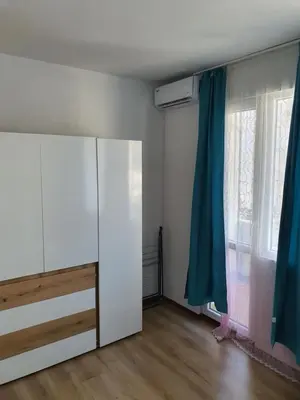 a room with a white cabinet and a window at THE CENTER Apartments Comfort in Sandanski