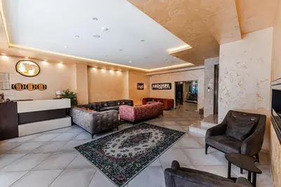 a living room with couches and chairs at Ardo Spa Hotel and Restaurant in Sarnitsa