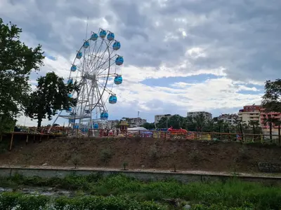 a ferris wheel on top of a hill at Riverpark Holiday Apartment, Sandanski in Sandanski