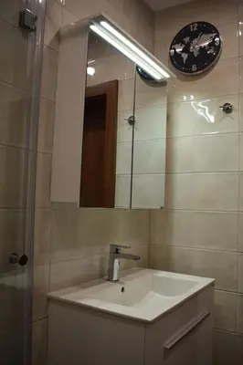 a bathroom with a sink and a mirror at Pirotska 47 apartment in Sofia