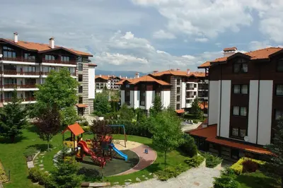 a park with a playground in the middle of a city at Winslow Infinity Aparthotel in Bansko