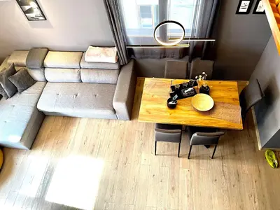 a small living room with a couch and a table at Апартаменти за гости ,,Friends