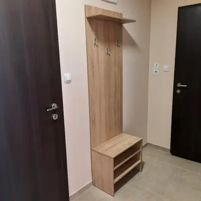 a wooden elevator in a room with a door at Апартамент Лидия in Chepelare