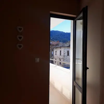 a door leading to a balcony with a view at Апартамент Лидия in Chepelare