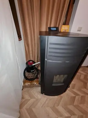 a television in a corner of a room at Pirin Golf Apartment HOME with private garden in Bansko