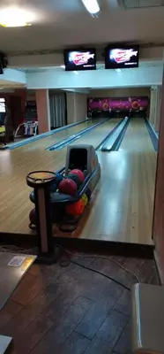 a bowling alley with a lane with balls on it at Grand Monastery Pamporovo Apartment for rent in Pamporovo