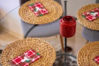a glass table topped with wicker baskets with christmas presents at Studio 9, St John Park in Bansko