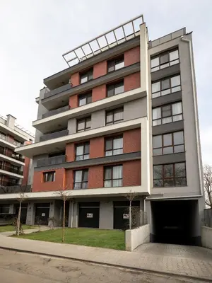 an apartment building with a red brick at The Boulevard Luxury Apartment in Sofia