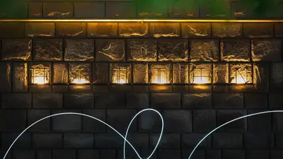 a wall with lights in front of a brick wall at HIDDEN BANK: DIAMONDS in Plovdiv