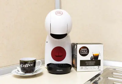 a coffee maker next to a box of coffee at Lovely 1BD Apartment close to the Summer Theatre by Flat Mаnager in Plovdiv