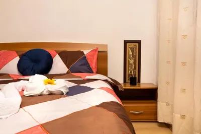 a bedroom with a bed with towels on it at Lovely 1BD Apartment close to the Summer Theatre by Flat Mаnager in Plovdiv