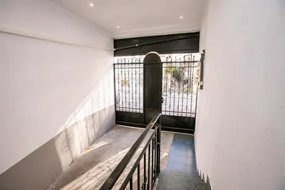 a hallway with a bench in a building at Paradise Apartment in Sandanski