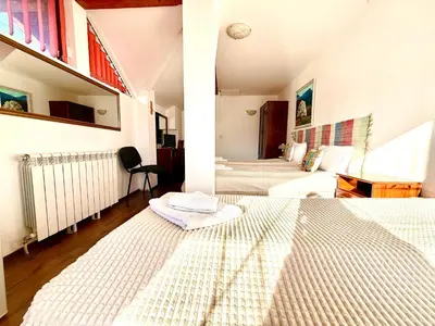 a bedroom with two beds in a room at Family Hotel Carpe Diem in Banya