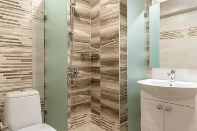 a bathroom with a toilet and a sink at Апартаменти 22 in Velingrad