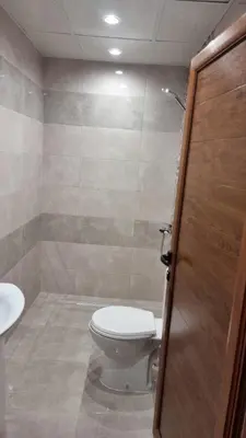 a bathroom with a toilet and a sink at Родопска къща за гости с.ЧАЛА in Chala