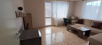 a living room with a couch and a table at Къща за гости Релакс-Рaдуил in Raduil