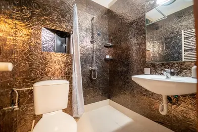 a bathroom with a toilet and a sink at Lovely apartment in Studentski grad in Sofia
