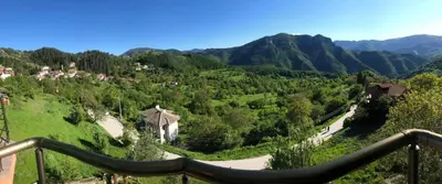 a view of a valley with mountains in the background at Хотел Варненци in Lŭki