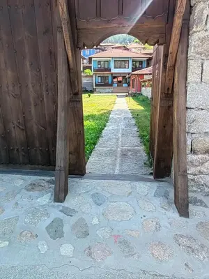 a view from the inside of a wooden gate of a house at Къща Ради in Koprivshtitsa
