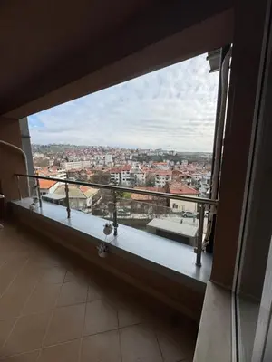 a large window with a view of a city at Луксозен апартамент в сърцето на Сандански in Sandanski