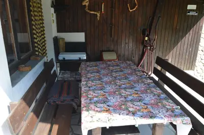 a bed in a room with a quilt on it at Вила Даяна in Ribarica