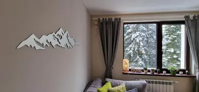 a living room with a couch and a window at Pine Tree Apartment / Borovets Gardens in Borovets