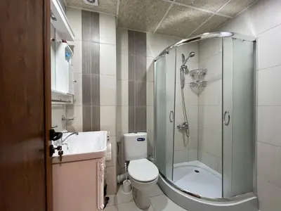 a bathroom with a shower and a toilet and a sink at Georgievi Apartments Sandanski in Sandanski