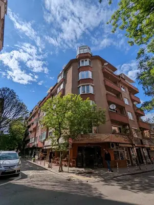a tall building on the side of a street at Top Center Relax, NDK & Vitoshka & Metro station in Sofia