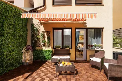 a patio with chairs and a table with fruit on it at Free Parking On Premises Huge Terrace in Sofia
