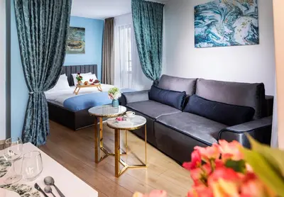 a living room with a couch and a bed at Free Parking On Premises Huge Terrace in Sofia