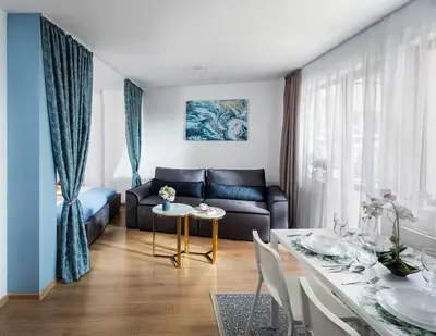 a living room with a couch and a table at Free Parking On Premises Huge Terrace in Sofia