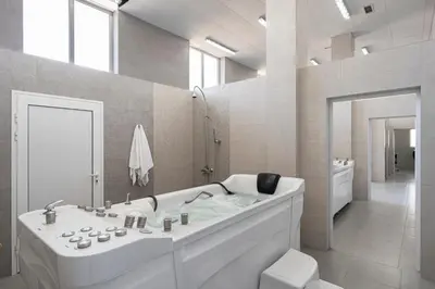 a white bathroom with a tub and a toilet at 7 Lakes camping in Sapareva Banya