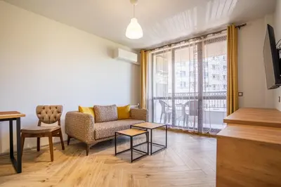 a living room with a couch and a table at Amarant Aparts in Sofia