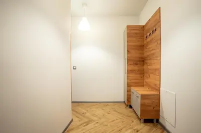 a room with a closet and a wooden door at Amarant Aparts in Sofia