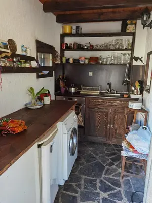 a kitchen with a sink and a washing machine at Guest house Smolyan in Smolyan