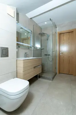 a bathroom with a toilet and a sink and a shower at Луксозни студия “Старият Батак” / Luxury studios “The Old Batak” in Batak