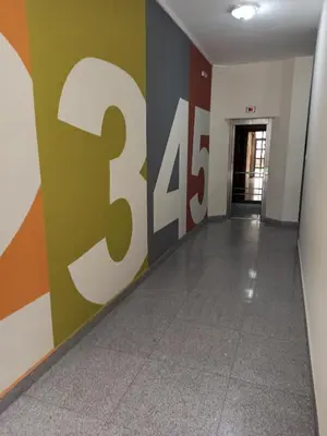 a hallway with a sign on the wall at Azalia Sandanski in Sandanski