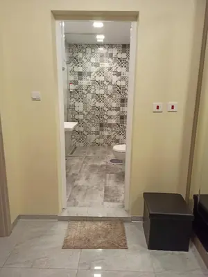 a bathroom with a sink and a toilet in a room at Azalia Sandanski in Sandanski
