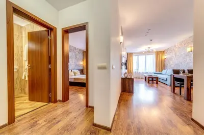 a living room with a couch and a table at Oak Residence Hotel & Relax in Smolyan
