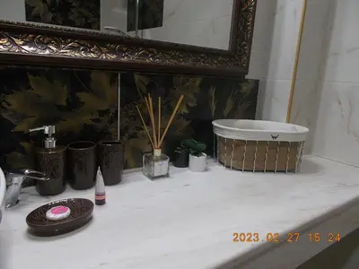 a bathroom counter with a sink and a mirror at Апартамент ВАНЕСА in Velingrad