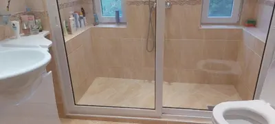 a shower with a glass door in a bathroom at villa Tia Maria in Hisarya