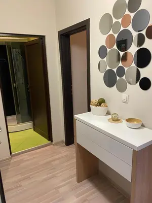 a bathroom with a counter and a mirror at Modern & Central 1BR Apartment with lovely terrace in Plovdiv