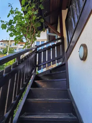 a stairway leading up to a building with a stair case at Room for guests in Smolyan